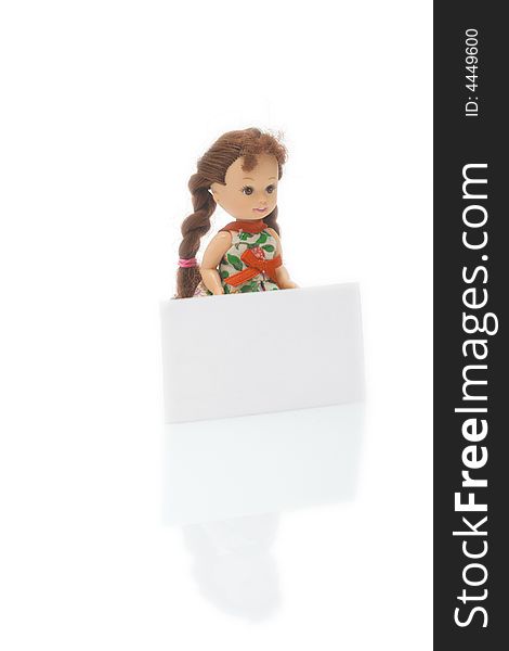 A little doll with white blank card isolated on white background. A little doll with white blank card isolated on white background