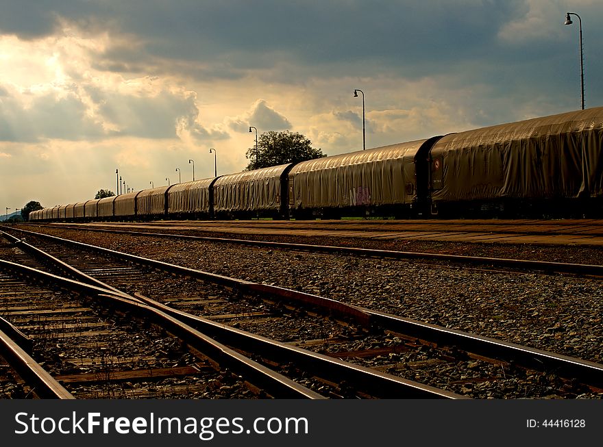 Long train under the evening sky. Long train under the evening sky