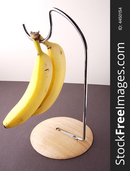 Still life image of Bananas on a stand
