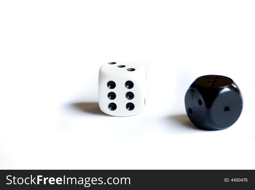 Isolated white and black dice. Isolated white and black dice