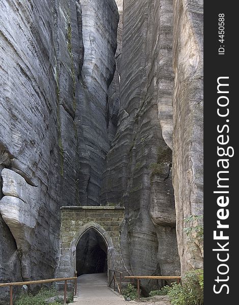 Stone gothic gate leading into the rock town called Adrspach in Czech republic. Stone gothic gate leading into the rock town called Adrspach in Czech republic