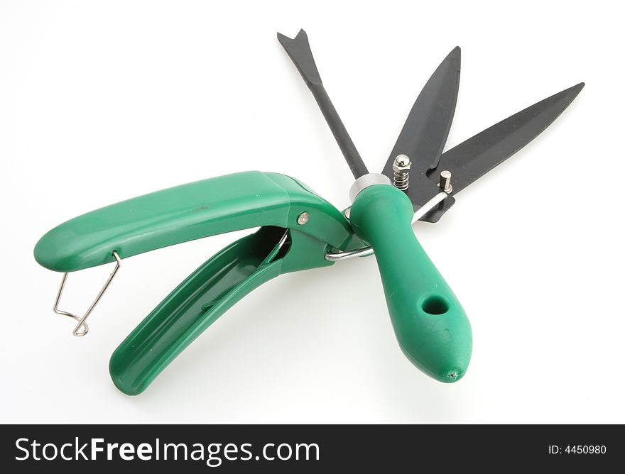 Gardening tools weed clippers and weed digger white background. Gardening tools weed clippers and weed digger white background