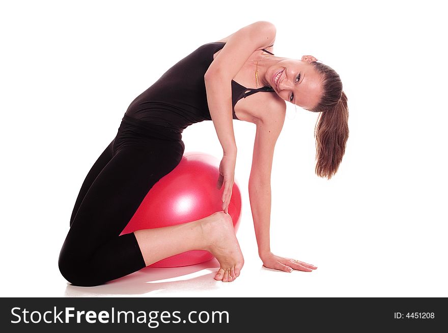 A young girl exercise with ball rollout. A young girl exercise with ball rollout