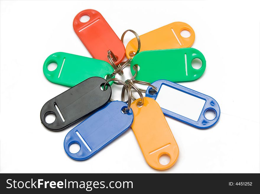 Multicolored plastic trinkets on a white background