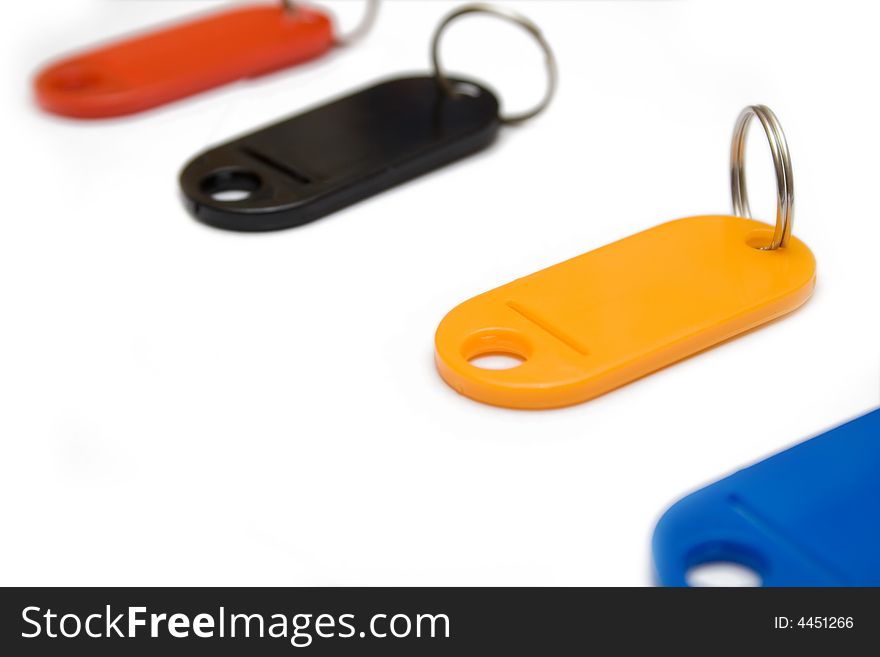 Multicolored plastic trinkets on a white background