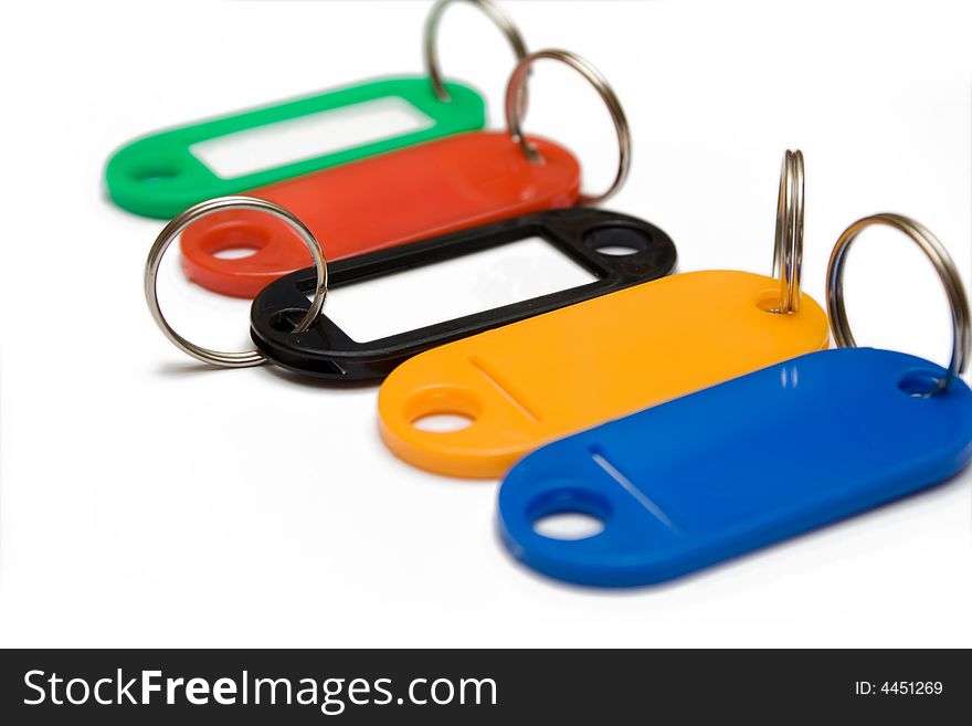 Multicolored plastic trinkets on a white background