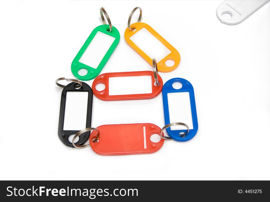 Multicolored Plastic Trinkets On White Background