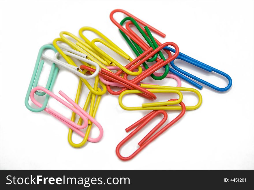 Multicolored Paper-clip On The White Isolated Back