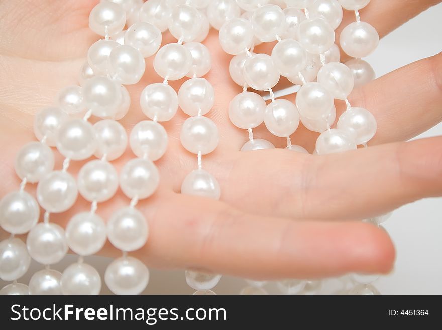 Pearls on the woman hand. Pearls on the woman hand