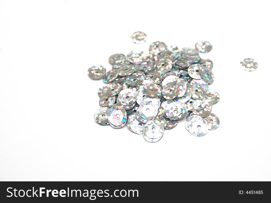 Silver confettis on the isolated background