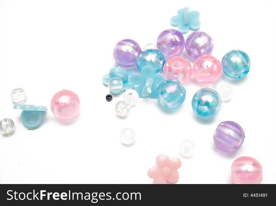 Pink and blue beads on the isolated background