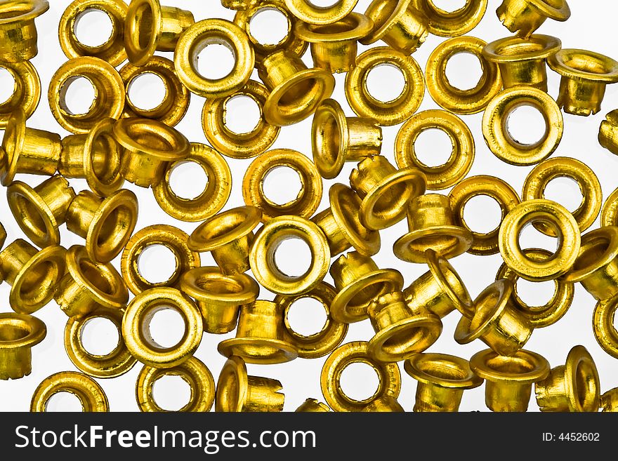 Golden rivets isolated on white