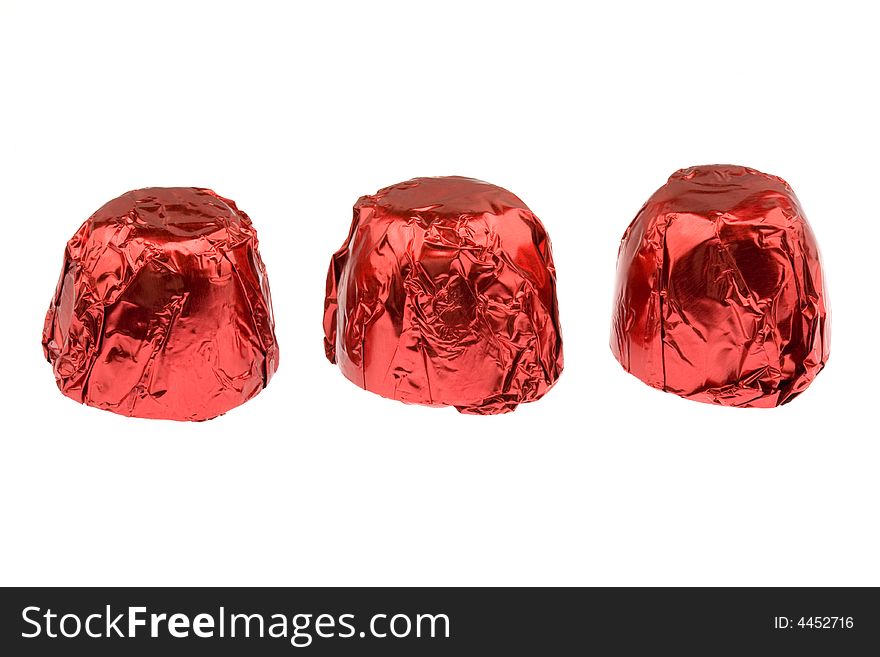 Three red chocolates isolated on white. Three red chocolates isolated on white