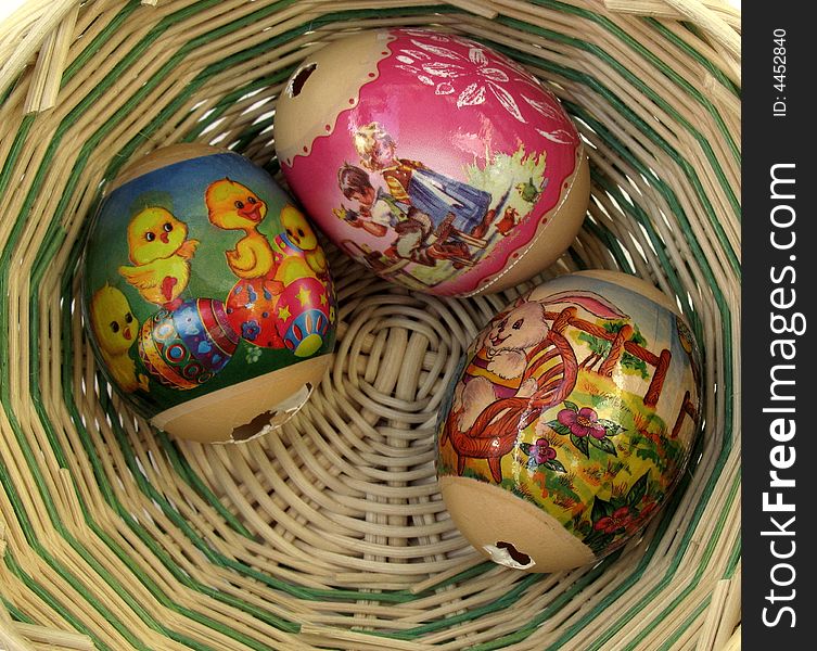 Three decorated Easter eggs in a basket. Three decorated Easter eggs in a basket