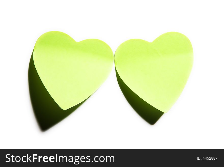 Two sticky hearts isolated on white