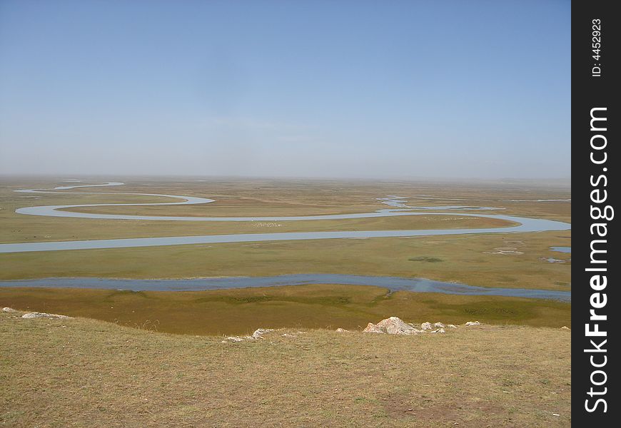 River running across the grassland of monglia. River running across the grassland of monglia