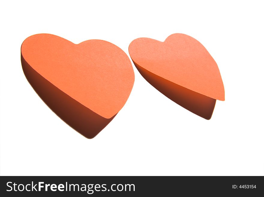 Two sticky hearts isolated on white