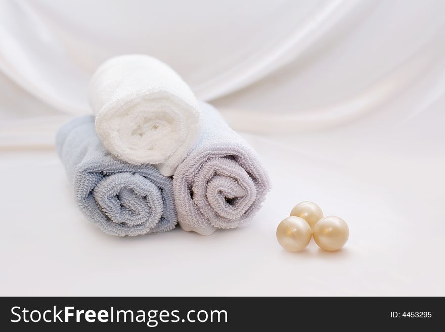 SPA Items - towels and soap bowls on a white background