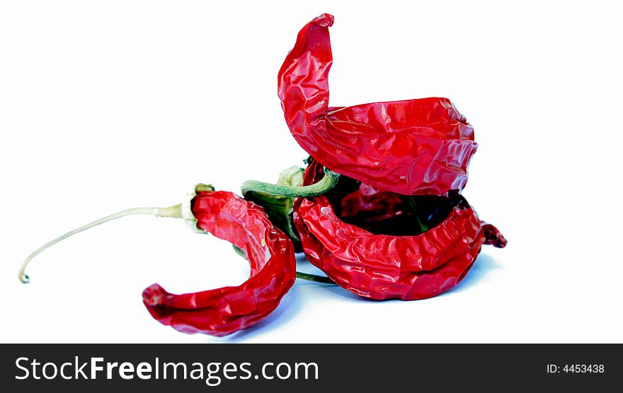 Three red hot dried peppers. Three red hot dried peppers.