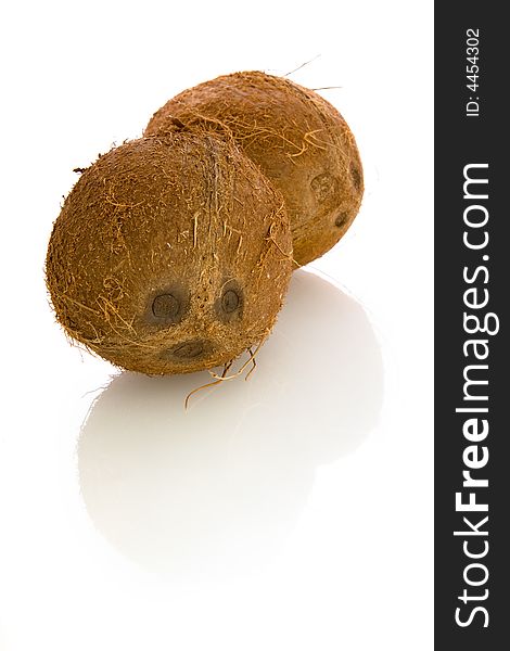 Two coconuts isolated over white background