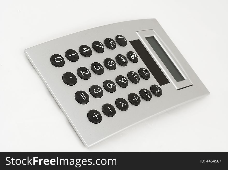 Photo of a silver calculator on a white background