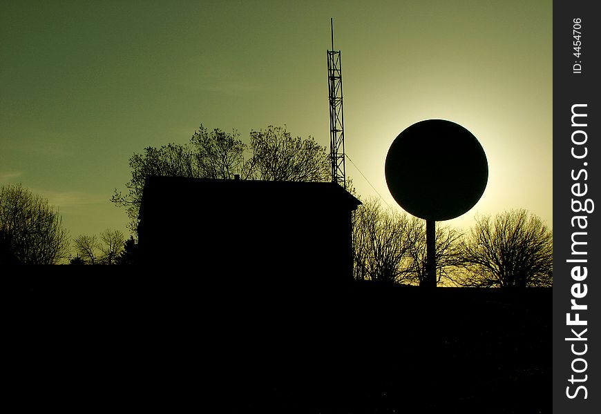 Sun hiding behind the satellite