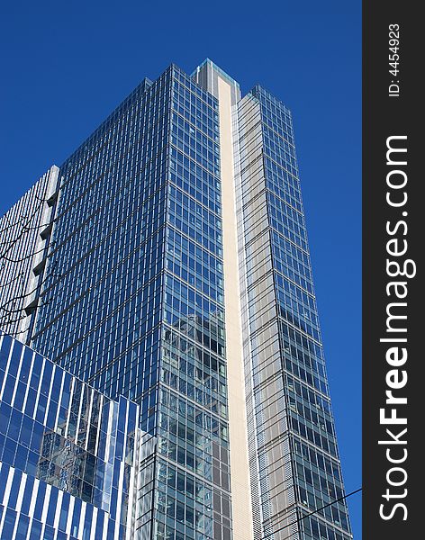 Buildings reflected in the windows of a skyscraper