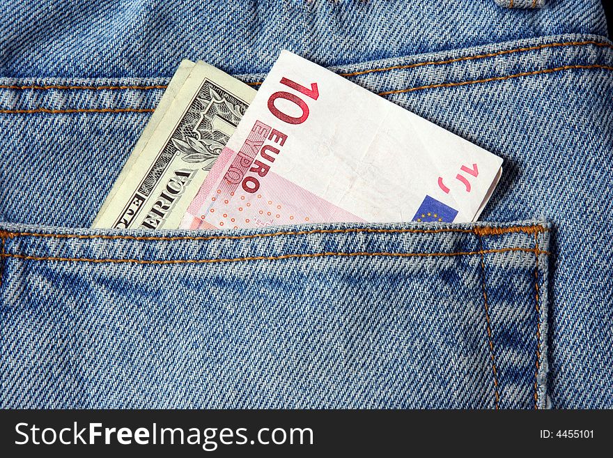 Euro and dollar in a trousers pocket. Euro and dollar in a trousers pocket