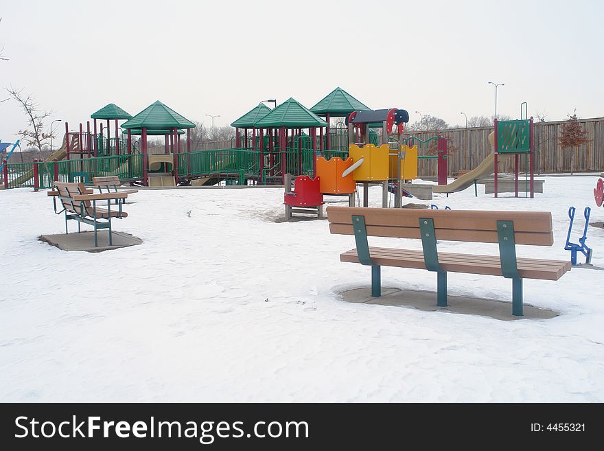 A picture of an empty playground in the wintertime