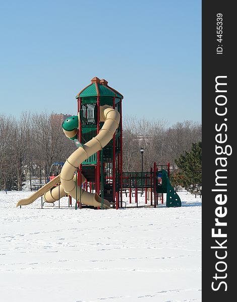 A picture of a tall slide standing in park