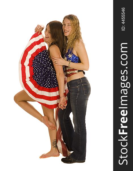 Attractive female American patriots with flag isolated over white having fun