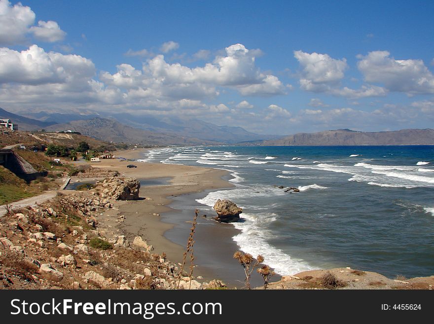 Beautiful landscape with blue waves crashing to the shore