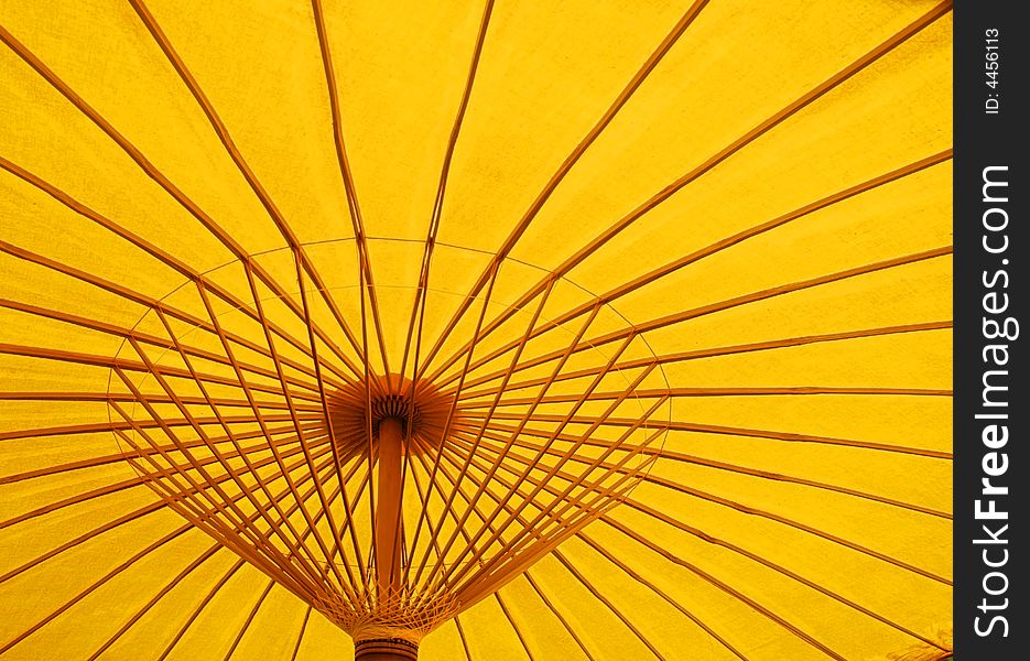 A detail image of a yellow parasol