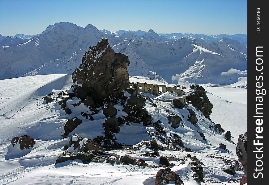 Ruins of a building in snow-covered mountains. Ruins of a building in snow-covered mountains