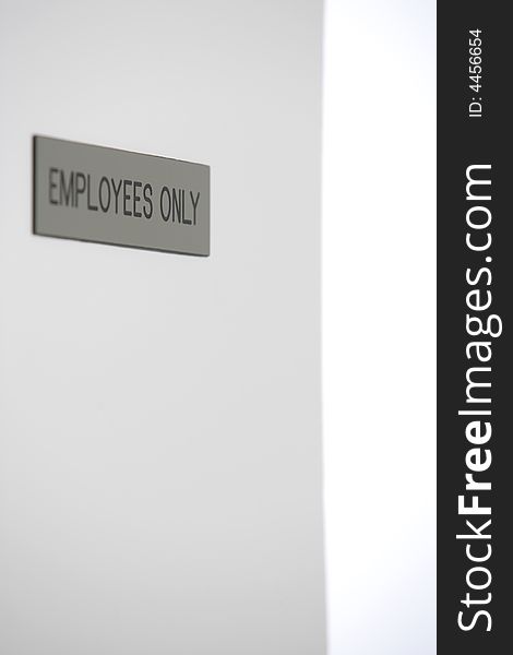 Employess Only Sign in a hallway. Employess Only Sign in a hallway