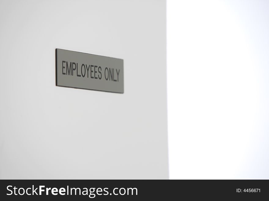Employess Only Sign in a hallway. Employess Only Sign in a hallway