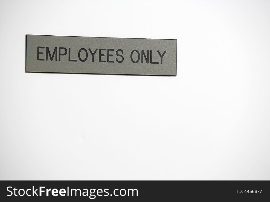 Employess Only Sign in a hallway. Employess Only Sign in a hallway