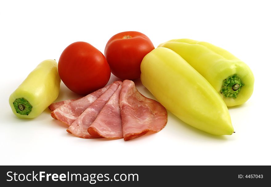 Cured meat with vegetables isolated on white background