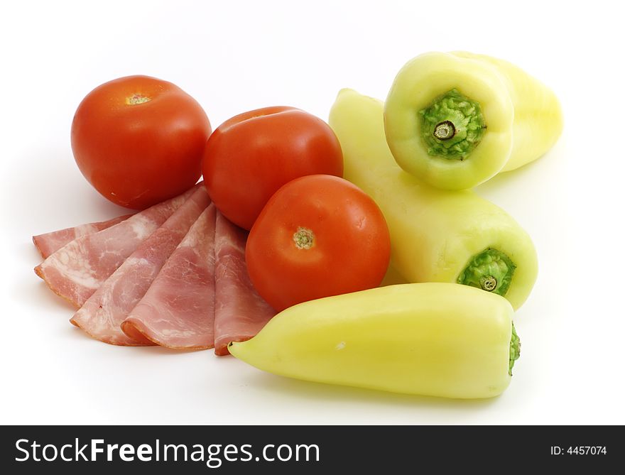 Cured meat with vegetables isolated on white background