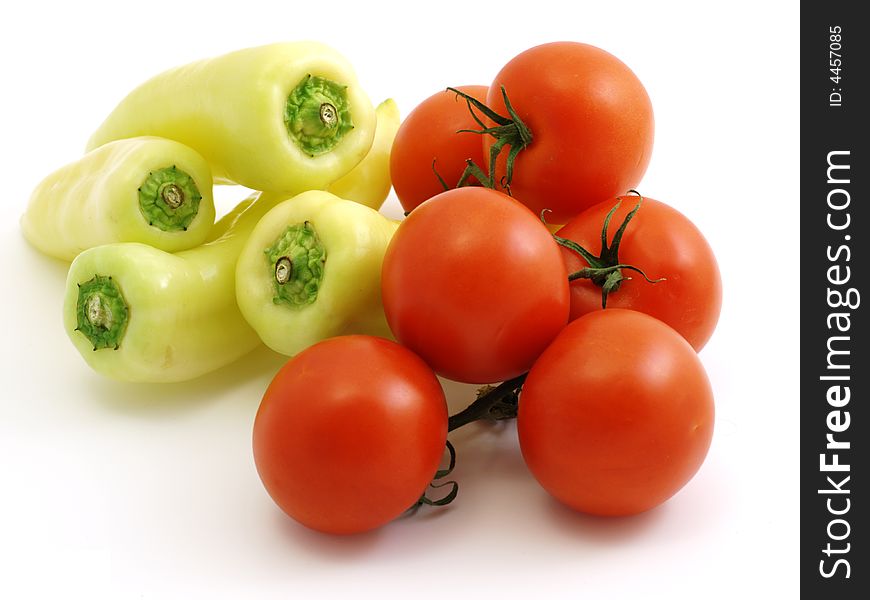 Peppers and tomatoes isolated on white background. Peppers and tomatoes isolated on white background