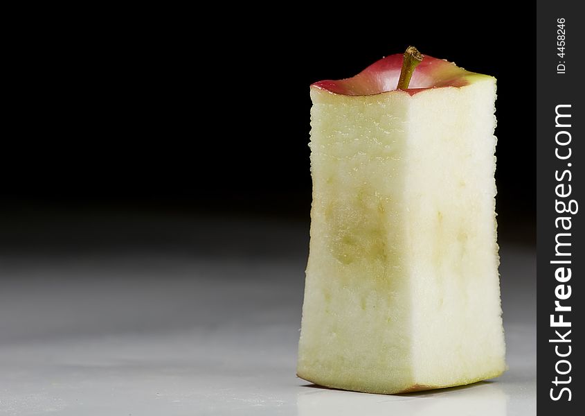 Deliciously juicy cut apple with stem on background. Deliciously juicy cut apple with stem on background