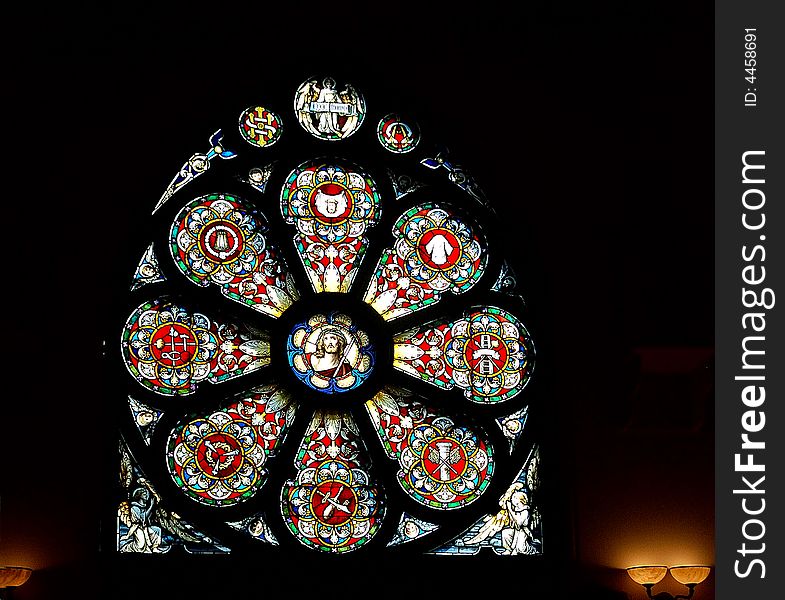 Stained-glass window in church with scene symbol religious