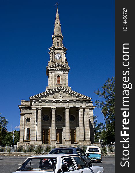 Cradock, South Africa. The bell tower & clock & front entrance of the the church building on the main road in the center of the town. Cradock, South Africa. The bell tower & clock & front entrance of the the church building on the main road in the center of the town.