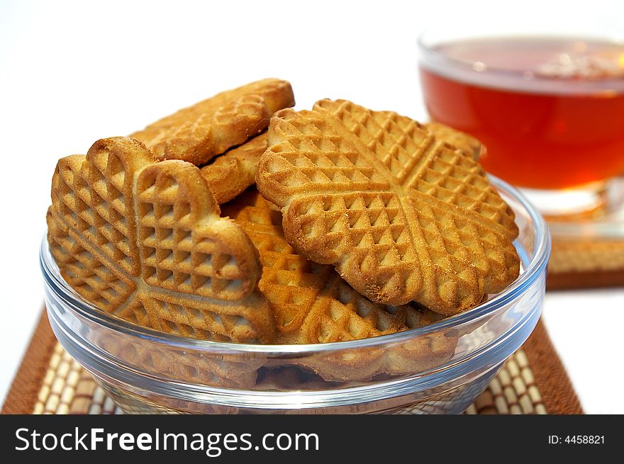 Cookies  and  cup of tea on a white background