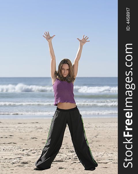 Woman stretching at the beach