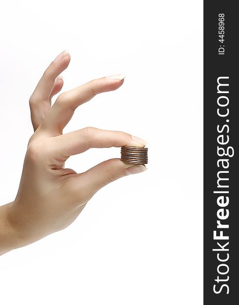 Coins in woman fingers over white background