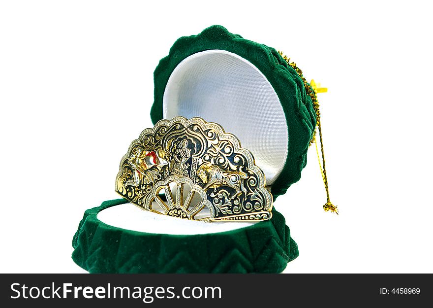 Precious brooch in the green box on white background