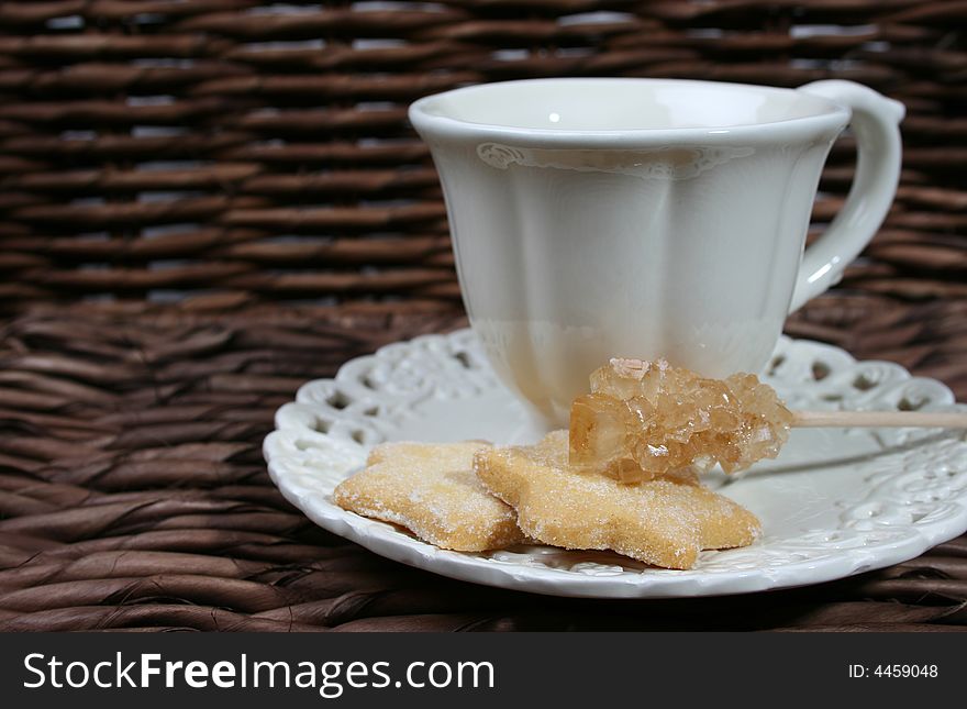 Cup and saucer with star shaped biscuits. Cup and saucer with star shaped biscuits