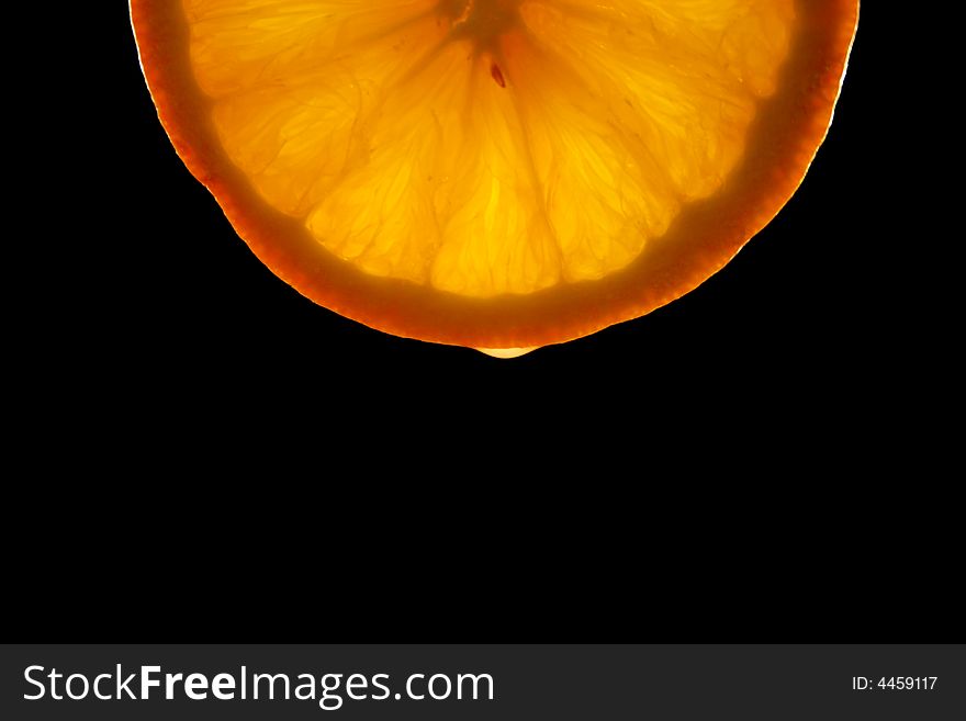 Orange slice with dark background. Orange slice with dark background.