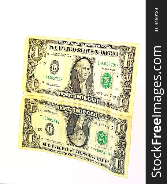 An old and yellowed one dollar banknote on a mirror. An old and yellowed one dollar banknote on a mirror